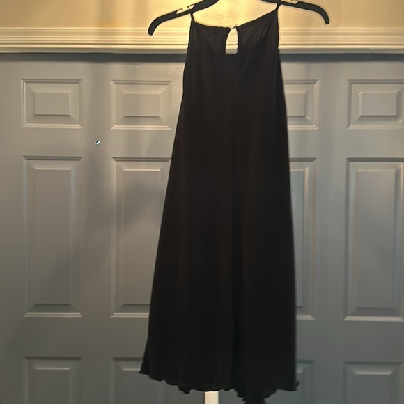Black dress. Unknown material but very luxurious and free flowing as you walk. - Picture 2 of 3